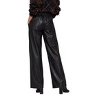 Black faux leather wide-leg pants with an elastic waistband, shown on a model from the back against a white background.