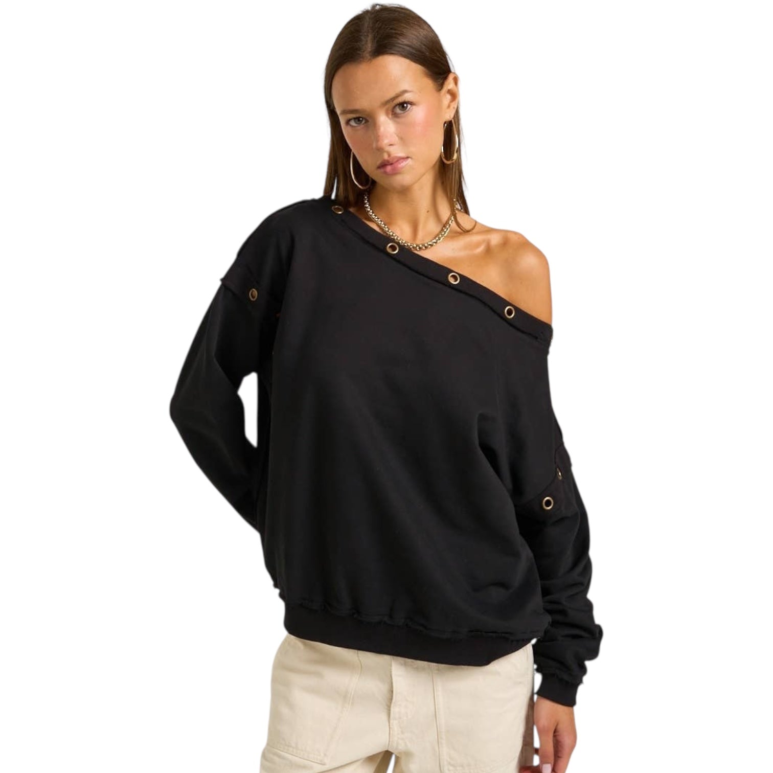 Woman wearing a black off-shoulder sweatshirt on a white background