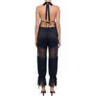Black lace outfit with open back on a white background