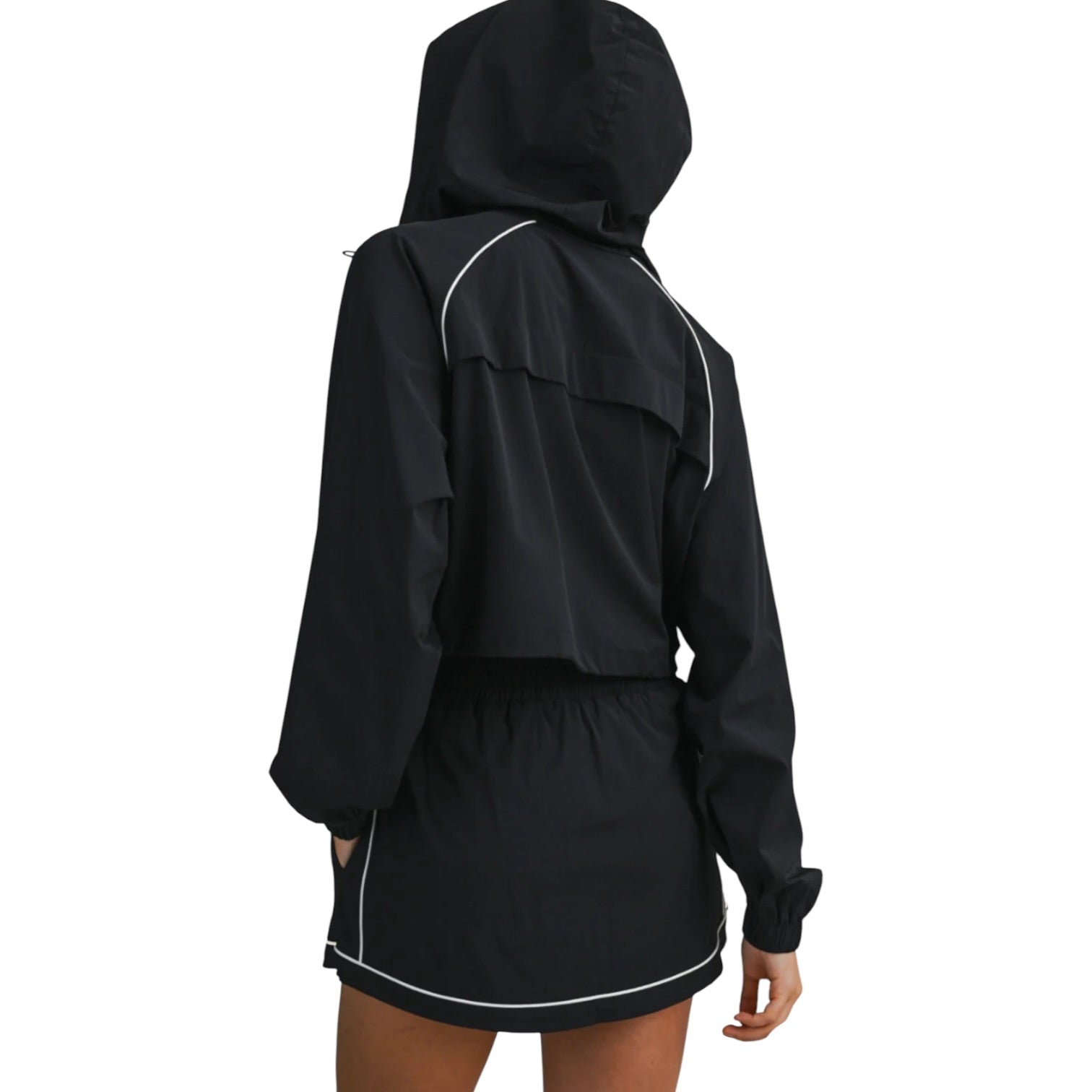 Black hooded outfit with white trim on a white background
