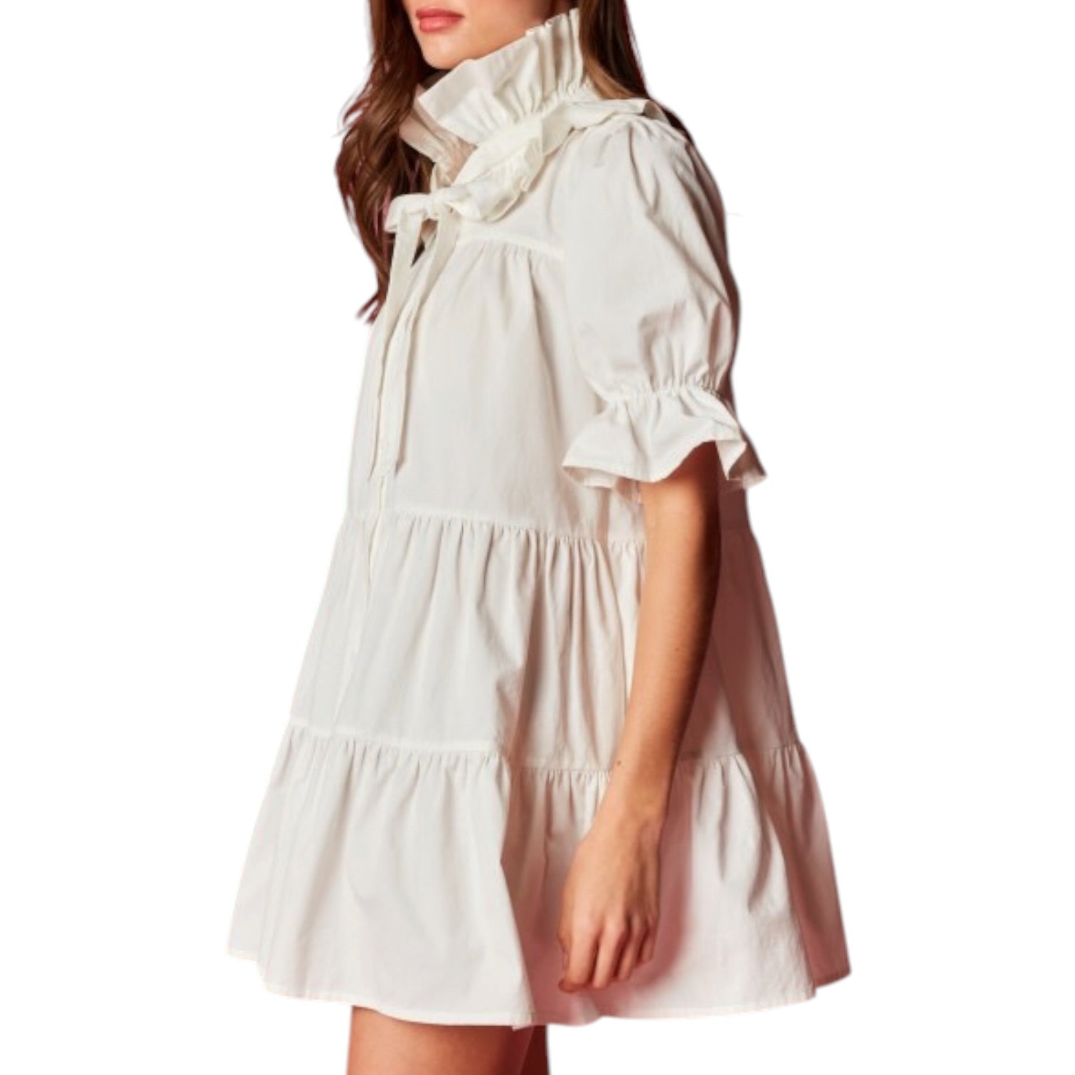 White dress with ruffled details on a white background