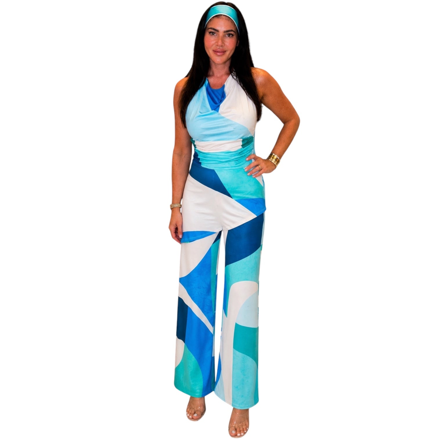 Woman wearing a blue and white patterned jumpsuit on a white background