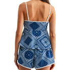 Blue patterned set worn by a person on a white background