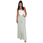 woman wearing floral lace pants with white background