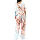 Woman wearing a floral set on a white background