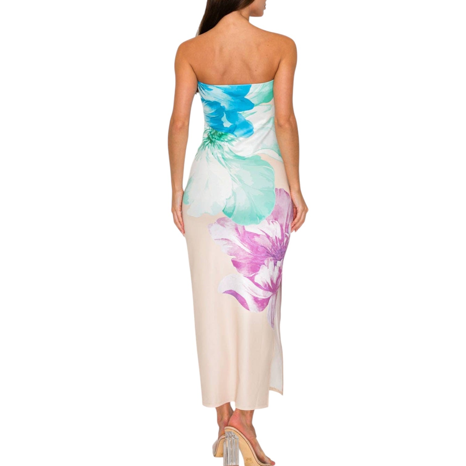 Woman wearing a strapless floral dress on a white background