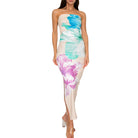 Woman wearing a strapless dress with floral pattern on a white background