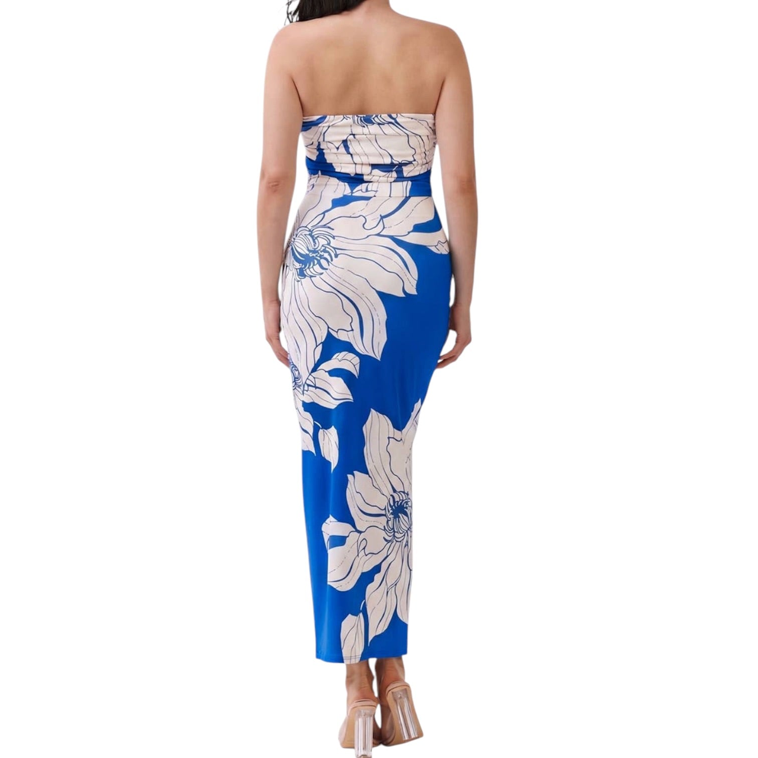 Woman wearing a strapless blue and white floral dress on a white background