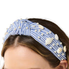 Blue and White striped knotted headband with pearls and seashells on white background