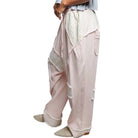 pink and Beige wide-leg pants with a textured pattern on a white background