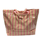 Pink and beige striped tote bag on a white background