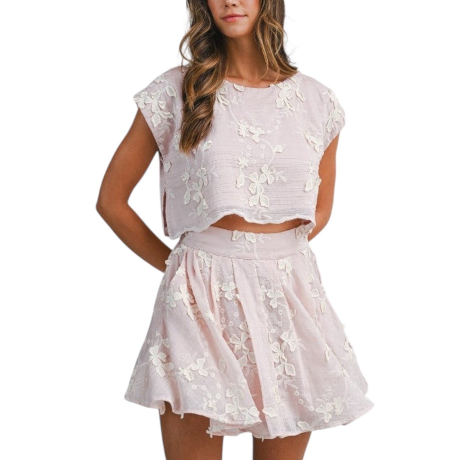 Pink lace top and skirt set on a white background