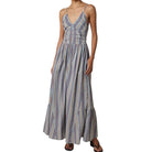 Woman wearing a striped dress on a white background