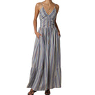 Long striped dress worn by a model on a white background