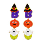 A pair of beaded drop earrings featuring a purple letter 'B' with a black witch hat, an orange pumpkin face, and a white and yellow ghost, shown on a plain white background.