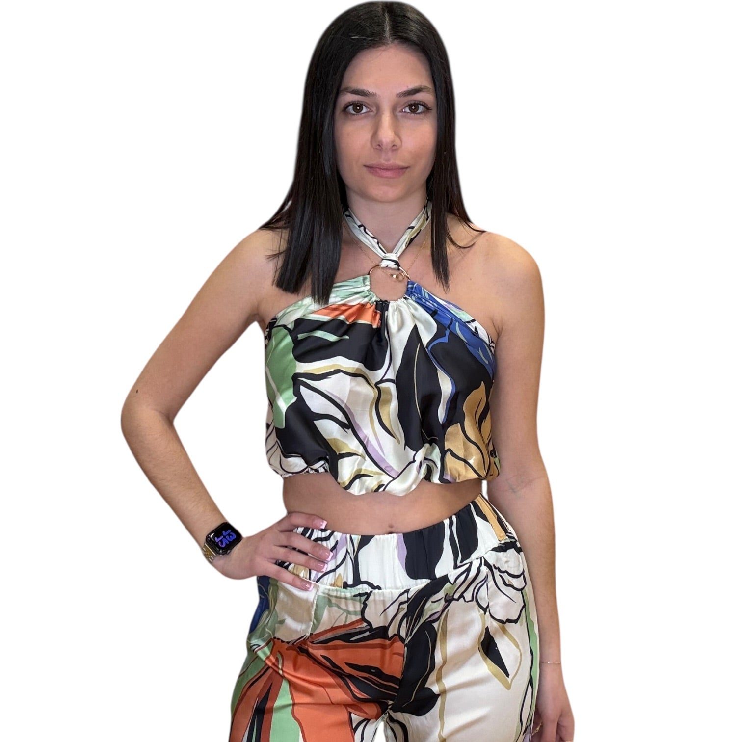 Woman wearing a colorful floral set on a white background