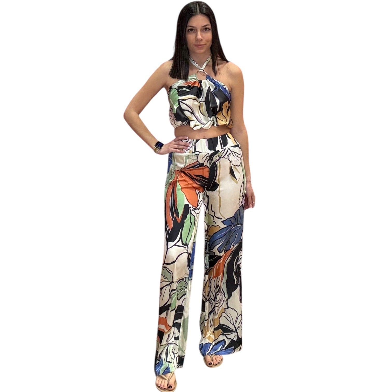 Woman wearing a colorful floral set on a white background