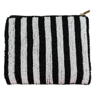 Black and white striped pouch with a gold zipper on a white background