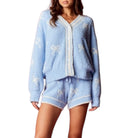 Light blue set with butterfly designs on a white background