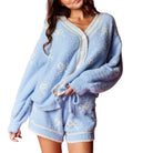 Light blue fleece set with white trim on a white background