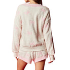 Light pink set with floral patterns on a white background