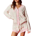 Fluffy pink and white set on a model against a white background