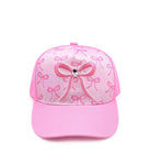 Pink cap with bow design on a white background