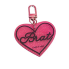 Pink heart-shaped keychain with 'Brat' text on a white background