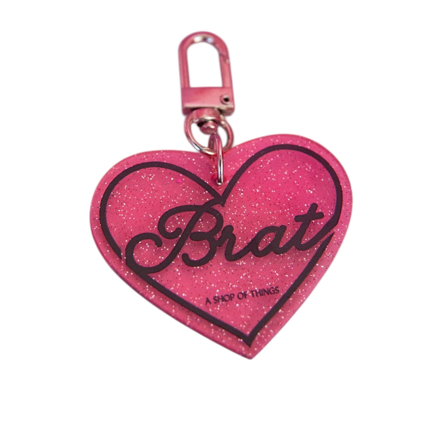 Pink heart-shaped keychain with 'Brat' text on a white background