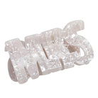 Set of pearl embellished hair clips on a white background