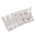 Set of white hair clips with pearl-like embellishments on a white background