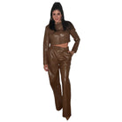 Woman wearing a brown pant set outfit on a white background