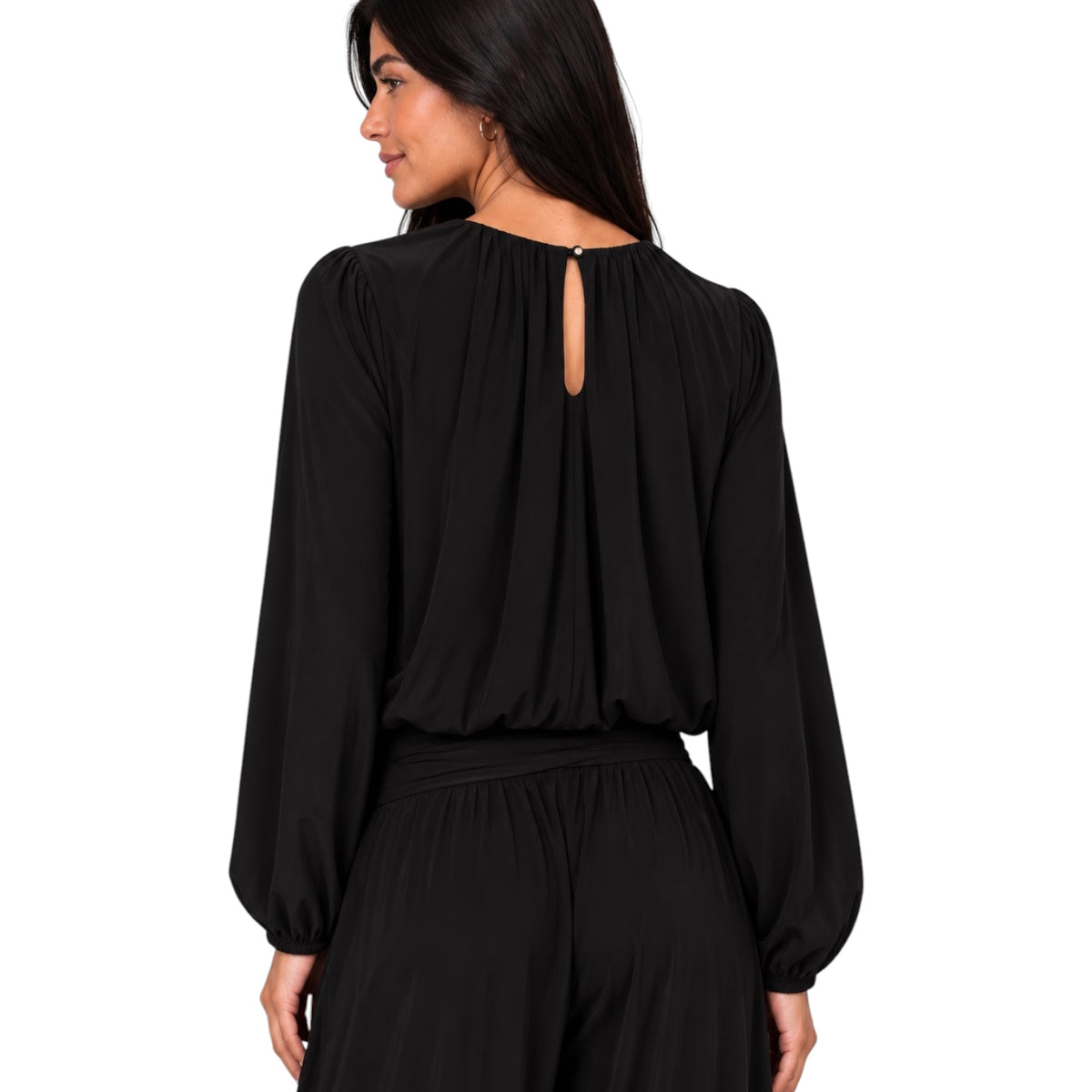 A woman shown from the back wearing a black long-sleeve top with a keyhole cutout at the neckline and matching black bottoms, against a plain white background.