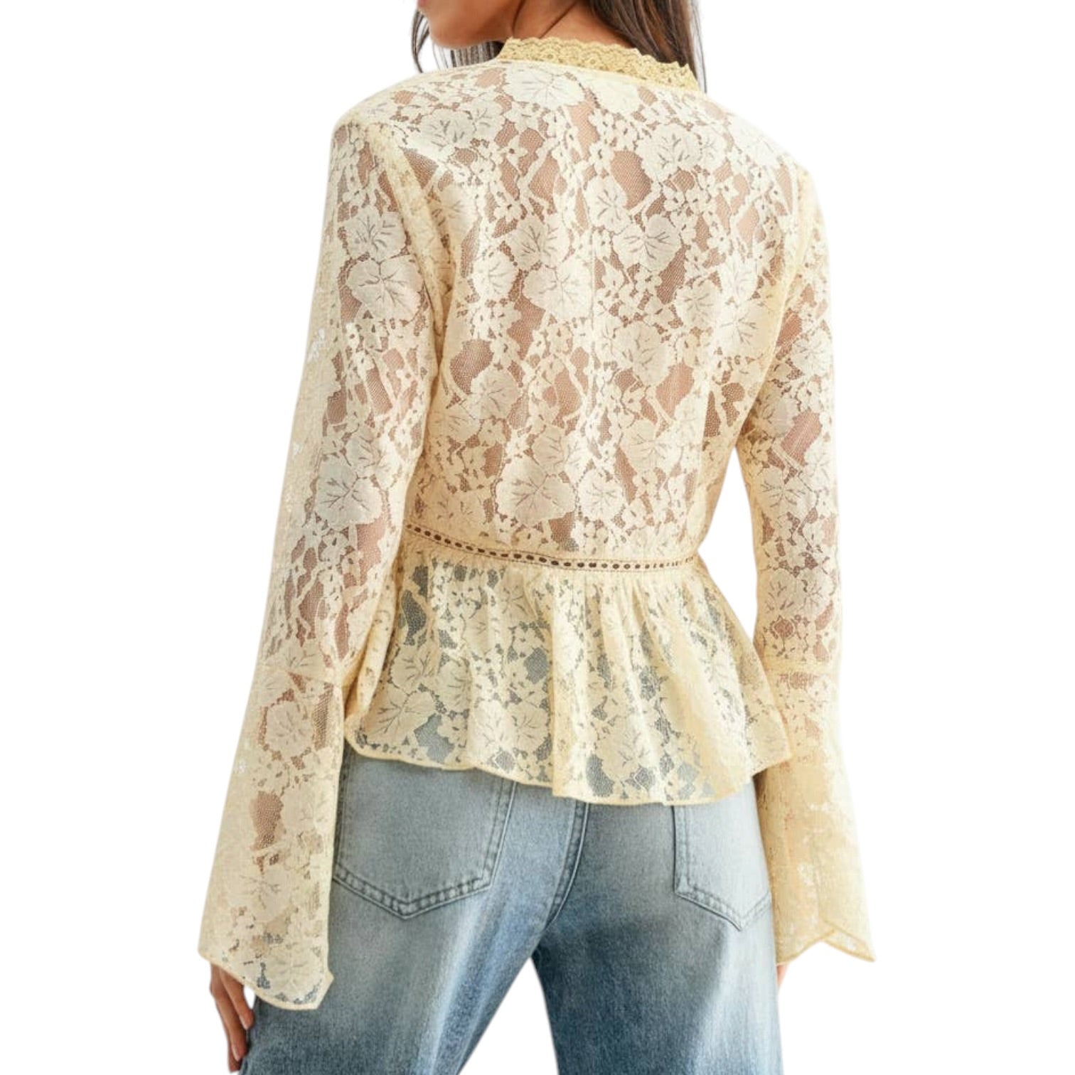 Beige lace top worn by a person on a white background
