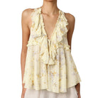 Yellow floral halter top on a white background