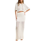 Woman wearing a white knit outfit on a white background