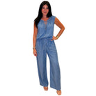 Woman wearing a blue denim set on a white background