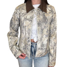 Camouflage jacket worn by a person on a white background
