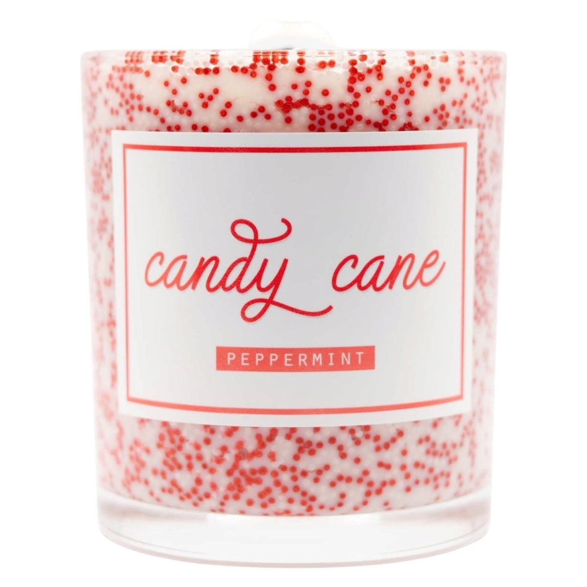 A clear glass jar candle filled with white wax and decorated with red speckles, featuring a white label with red text that reads 'candy cane' and 'PEPPERMINT'.