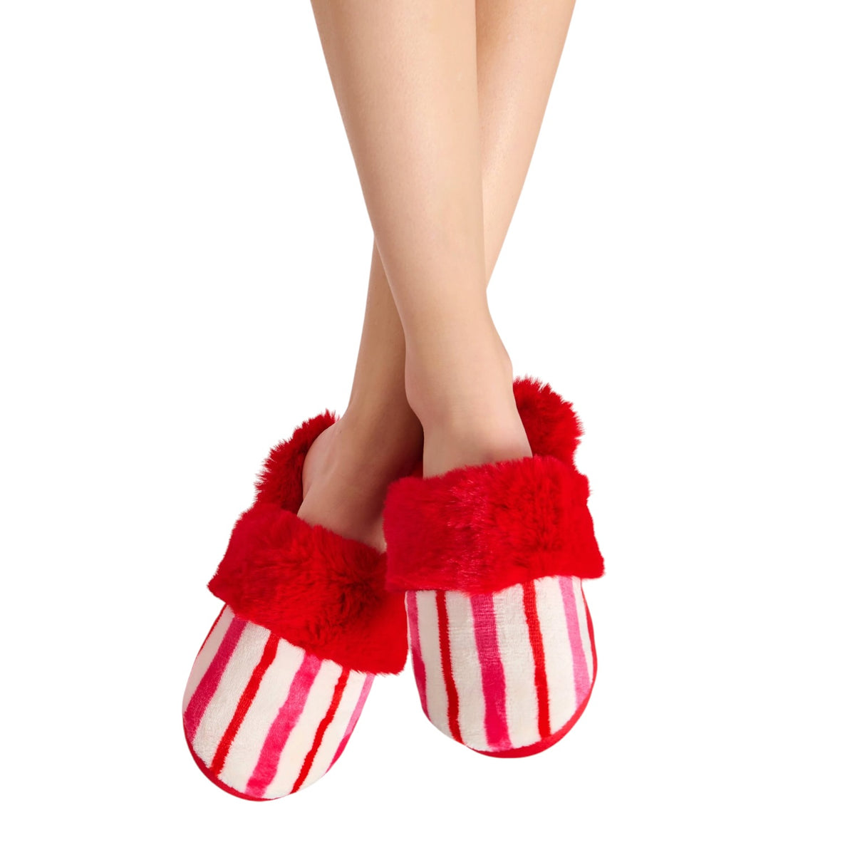Red and white striped fuzzy slipper slippers worn on a person's feet, shown against a plain white background.