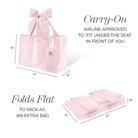 Pink tote bag with a bow, folded flat, and dimensions displayed on a white background.