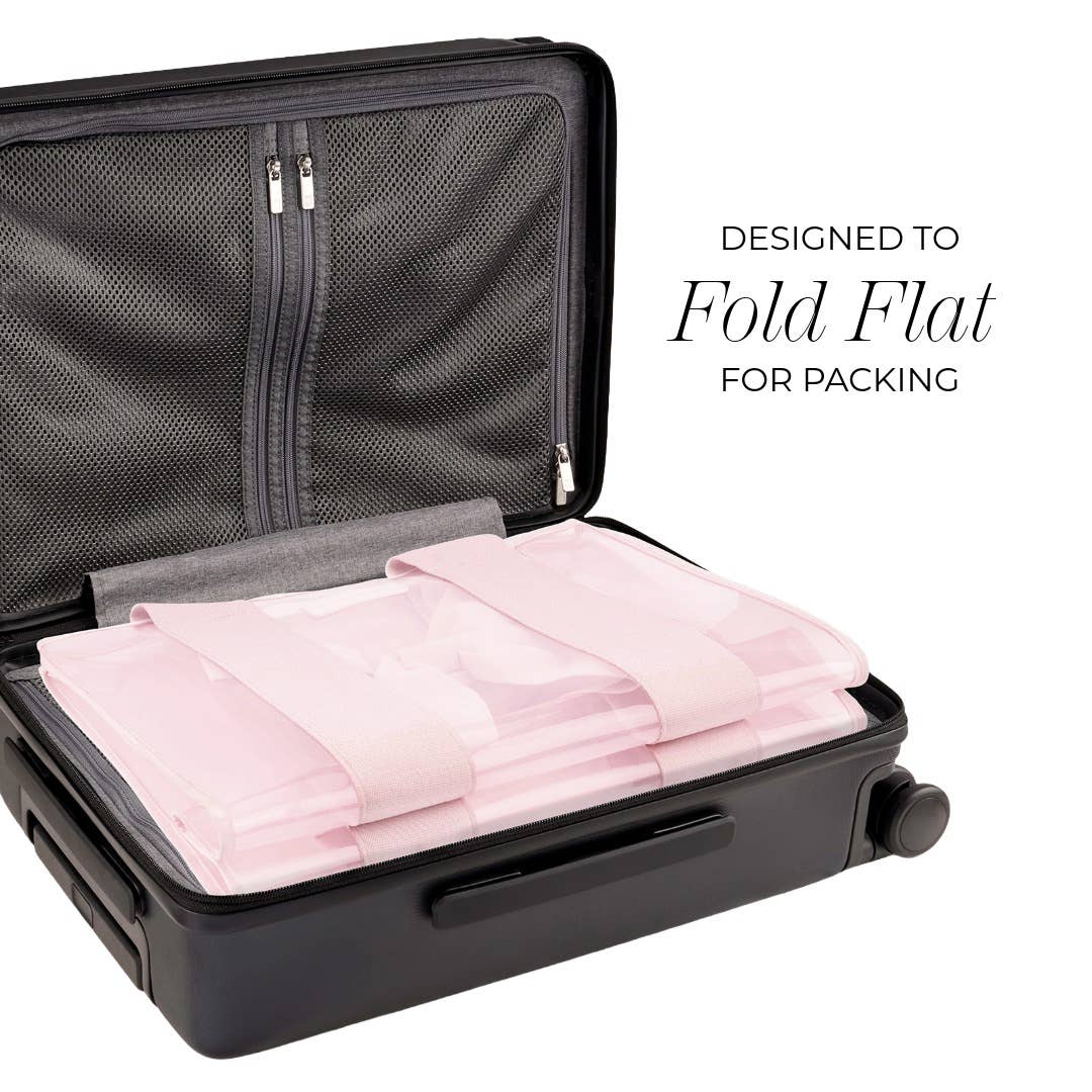 Black suitcase with pink folded clothes inside, labeled 'Designed to Fold Flat for Packing'.