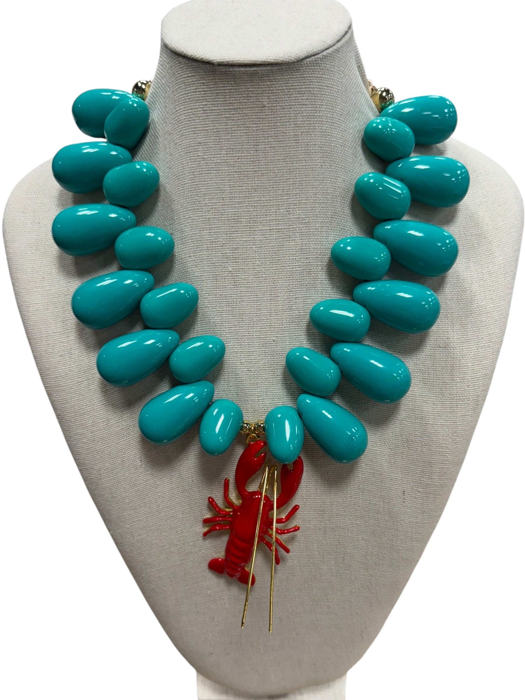 resin beaded necklace with lobster on white background.