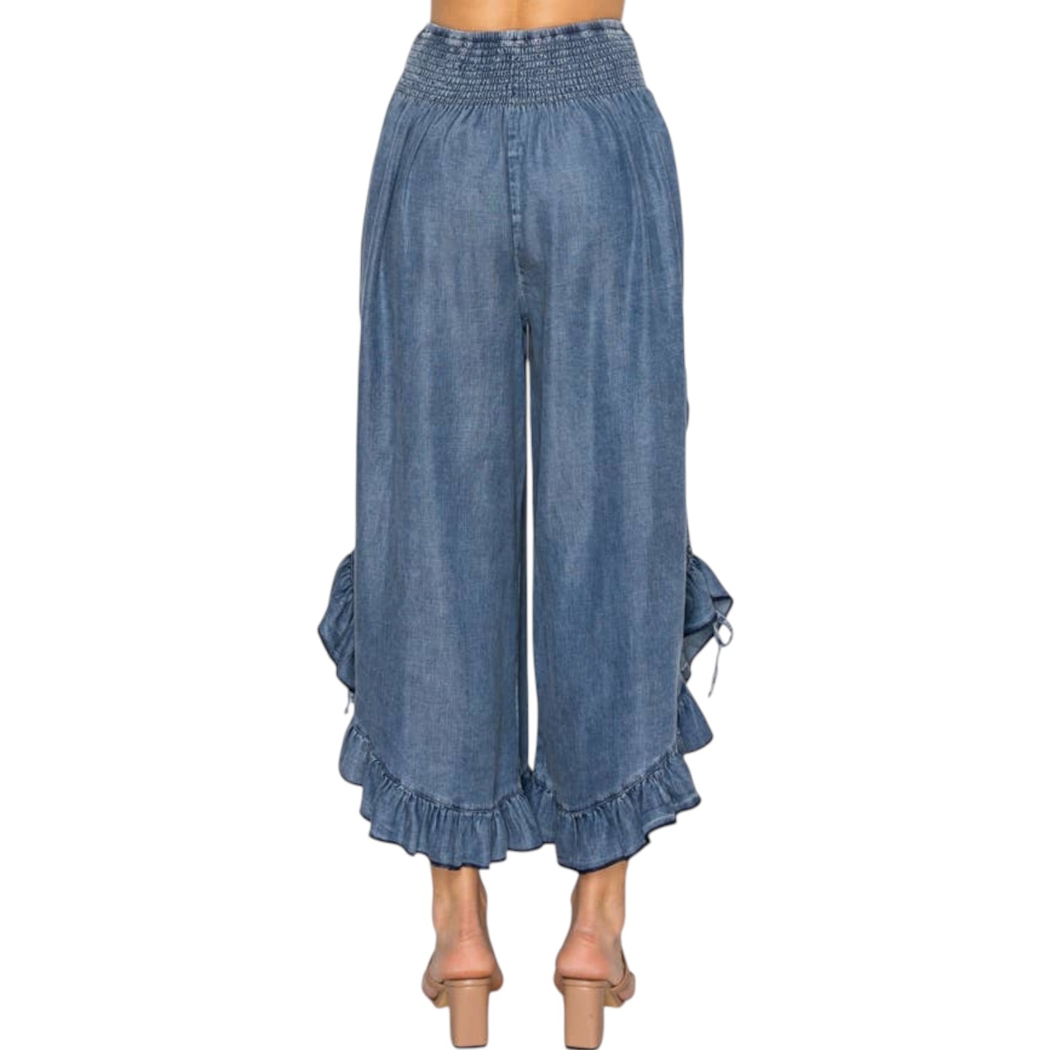 Person wearing chambray pants on a white background