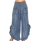 Person wearing chambray pants on a white background