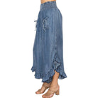 Person wearing chambray pants on a white background