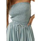 Light blue strapless jumpsuit on a white background