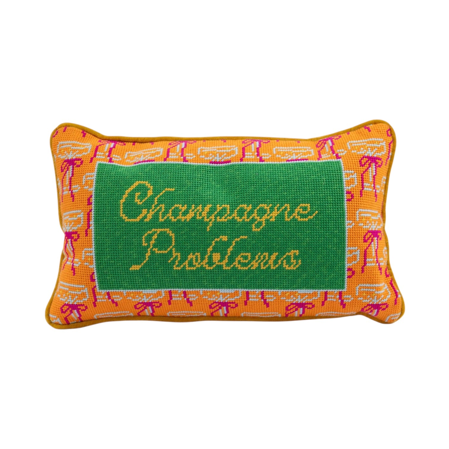 Pillow with 'Champagne Problems' text on a green background with orange border