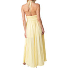 Yellow halter neck dress on a white background