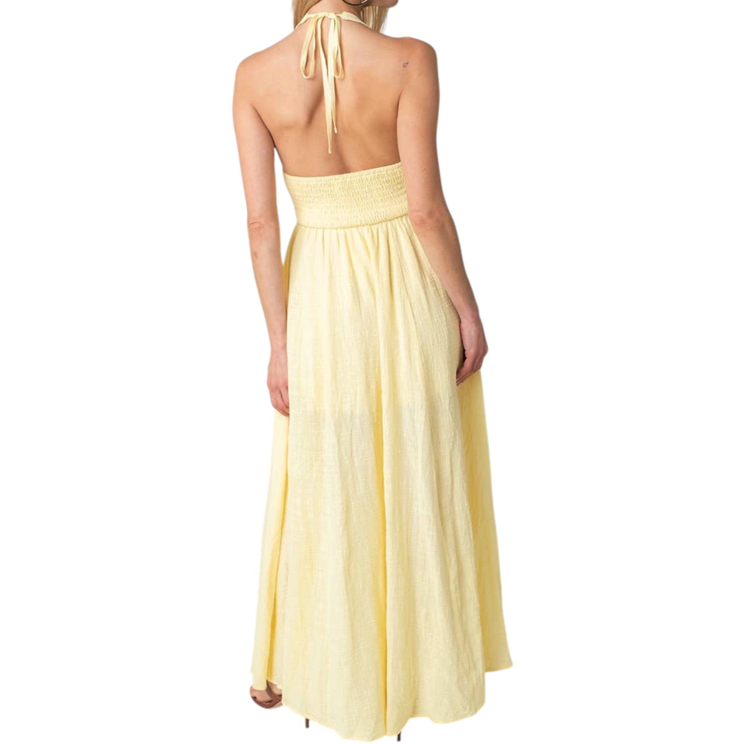 Yellow halter neck dress on a white background